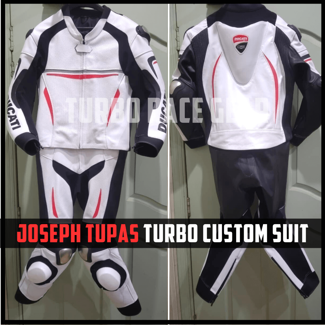 Motorcycle racing suit with Ducati logo on a plain background
